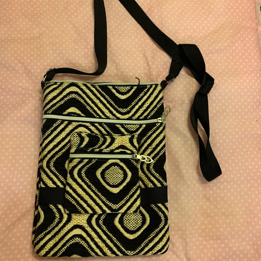 Crossbody double sided bag with many zippers
